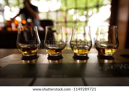 Bourbon Flight with selective focus on four samples Royalty-Free Stock Photo #1149289721