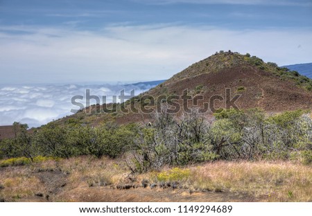 Red volcanic soil on the summit of Mauna Kea volcano on the Big Island of Hawaii
