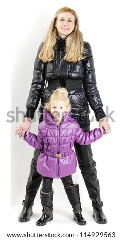 mother and daughter wearing jackets and black boots