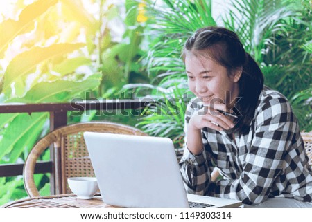 Happy business woman looking computer for confident