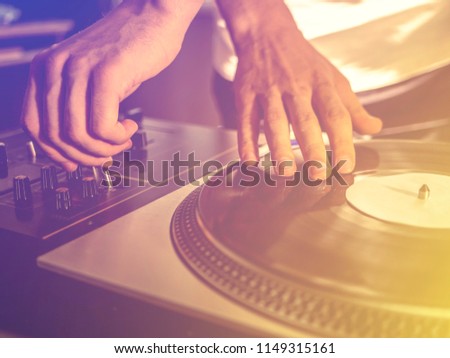 close up vintage look of dj playing vinyl record music on the party