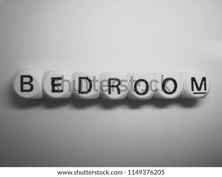 word bedroom spelled in dice