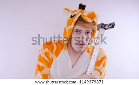 guy in a bright children's pajamas in the form of a kangaroo, on white background. emotional portrait of a student. costume presentation of children's animator.