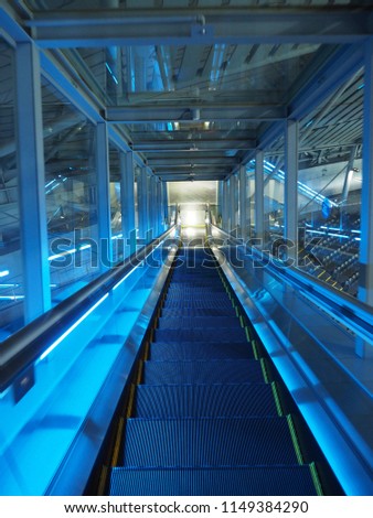 Long escalator under blue light