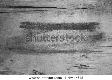 background, brush strokes with black paint on a wooden board, horizontal, texture