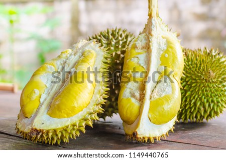 Durian riped and fresh ,durian peel with yellow colour on wooden table. Royalty-Free Stock Photo #1149440765