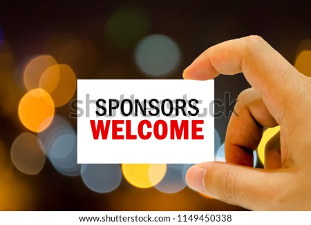 sponsors welcome written on business card man hand holding Royalty-Free Stock Photo #1149450338