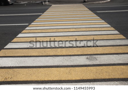 Yellow and white crosswalk
