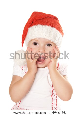 Portrait of joyful beautiful little girl in hat of santa claus isolated on white background