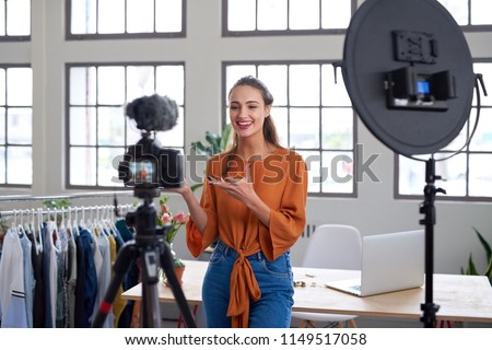 Social influencer creating online content for her channel, daily vlog Royalty-Free Stock Photo #1149517058