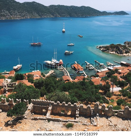 Kalekoy or known as Smyrna is a historic penninsula that dates back to the first century with famous king tombs and ruins from many civilizations once established there, located in front of Kekova. Royalty-Free Stock Photo #1149518399