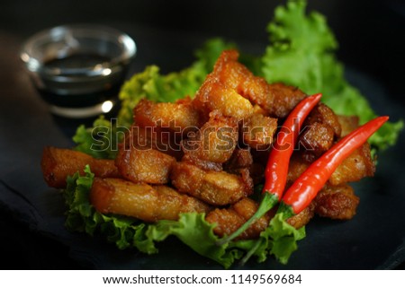 Still life photography of Ketogenic diet food: Streaky pork fried with fish sauce served with black sweet sauce. Selective and shift focus. Shoot in studio, Clean food good taste, ketogenic concept.