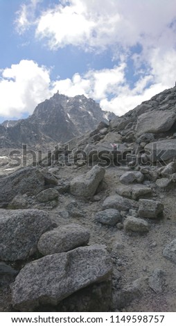 Wild scree full of loose boulers on the slopes leading up to Orny shelter in Swiss Alps - Mt Blanc Massif - Valais