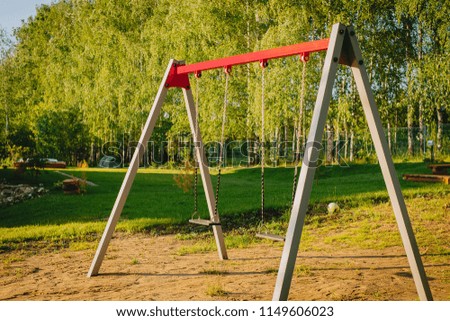 Children's playground: swings, slide, basketball ring
