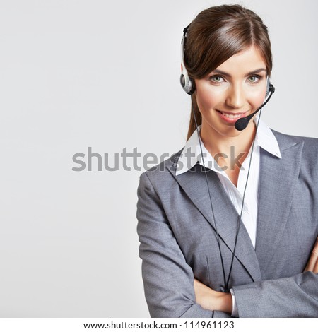 Portrait of smiling  business woman with head set, isolated.