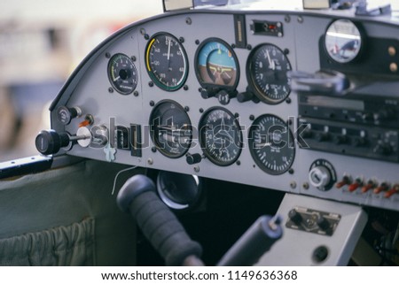 
The cockpit, the propeller and the landing gear of the light aircraft. Royalty-Free Stock Photo #1149636368