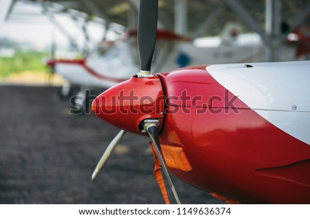 
The cockpit, the propeller and the landing gear of the light aircraft. Royalty-Free Stock Photo #1149636374