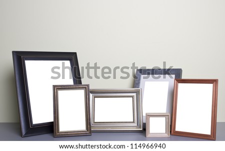 blank photo frames on the table