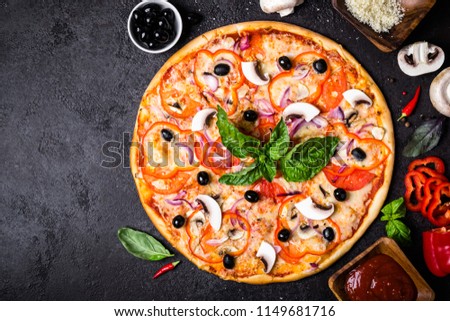 Vegetarian pizza with mushrooms and olives on black background. Royalty-Free Stock Photo #1149681716