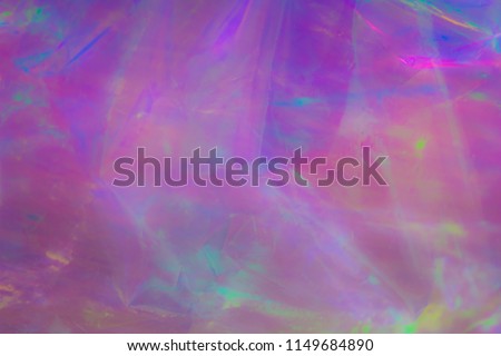 Rainbow colors, psychedelic pattern, holographic background. Magical marble and iridescent effect for banner templates and wallpapers. Purple shades. 