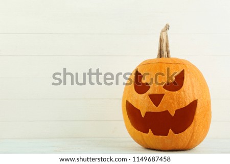 Halloween pumpkin on white wooden table