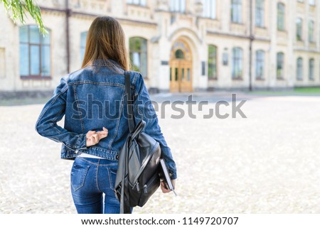 Not ready for exams lifestyle concept. Rear behind close up view photo portrait of scared afraid person in casual outfit black bag pack hope for success not to fail looking at doors