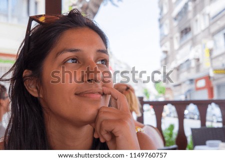 young woman thinking in the restaurant