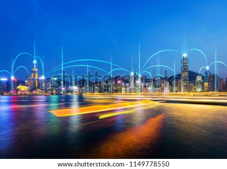 Network and Connection technology concept with Hong Kong city and light of boat background at dusk in Victoria harbor