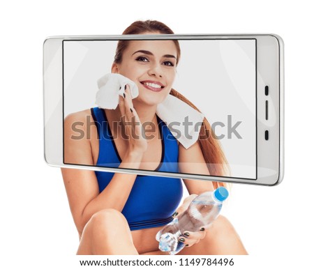 Fitness woman with bottle of water and towel on white background. conceptual collage with device