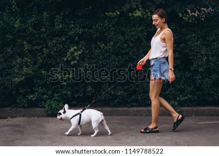 Woman with her pet french bulldog
