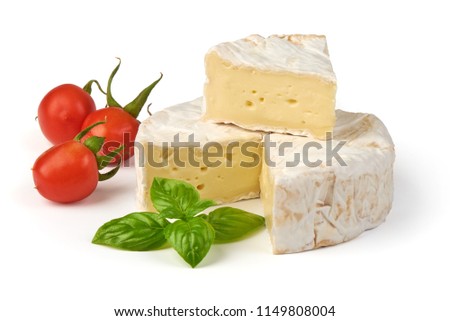 Round camembert cheese with a cut out piece, isolated on white background.