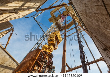 Drilling rig in oil field for drilled into subsurface in order to produced crude, inside view. Petroleum Industry Royalty-Free Stock Photo #1149820109