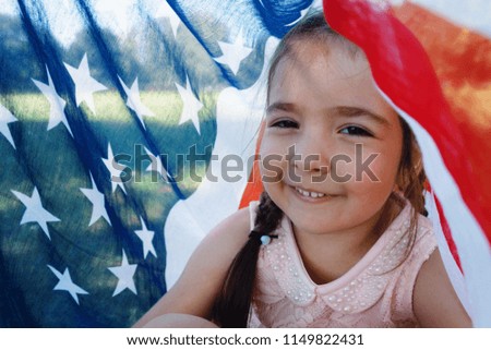 happy girl on american flag background close-up