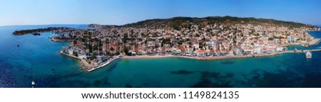Aerial drone bird's eye view ultra wide Panoramic photo of magnificent historic town in island of Spetses with traditional character and neoclassic houses, Saronic gulf, Greece