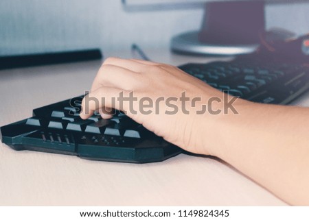 Hand on the keyboard close-up