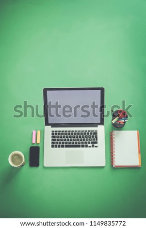 Close up of office desktop with coffee cup. Workplace concept
