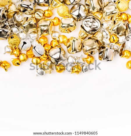 Gold and silver Jingle bells Christmas background. Flat lay,  top view