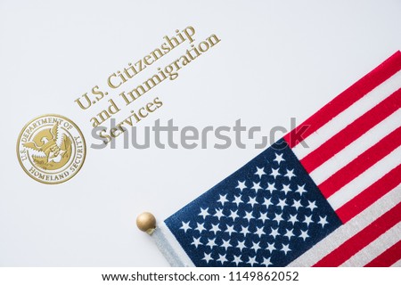 Envelope from U.S. Citizenship and Immigration Services with the American flag on top/U.S. immigration concept Royalty-Free Stock Photo #1149862052