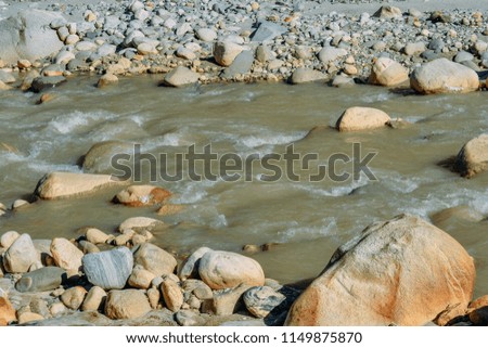 current of the river on mountain rocks in the daytime