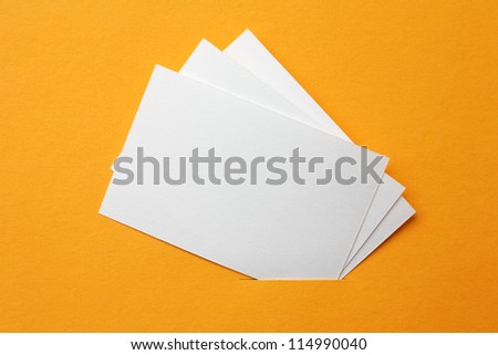 white paper cards on orange background