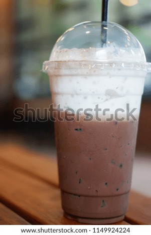 Iced chocolate on table background