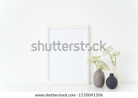 Elegant white portrait a4 poster mock up with a episcopal weed in gray and black vases on white background. Template for small businesses, lifestyle bloggers, social media