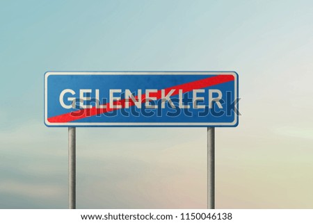 TRADITIONS - blue road sign with crossed out inscription in Turkish