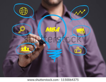 The concept of business, technology, the Internet and the network. Young businessman showing inscription: MBA