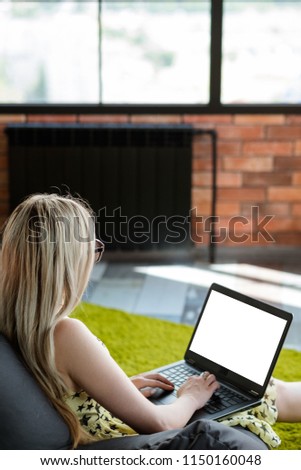virtual assistant. freelance job. remote work to earn money online. comfortable workspace at home. relaxed woman typing on laptop.