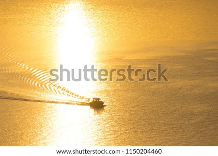 small boat in the river in sunset light