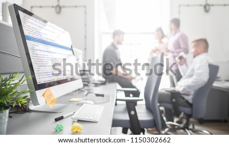 Developing programming and coding technologies. Website design. Programmer working in a software develop company office. Royalty-Free Stock Photo #1150302662