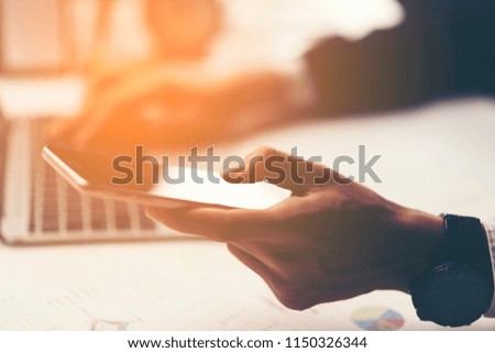 businessman using tablet smartphone for working in the office