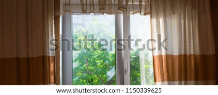 window with curtains in natural colors