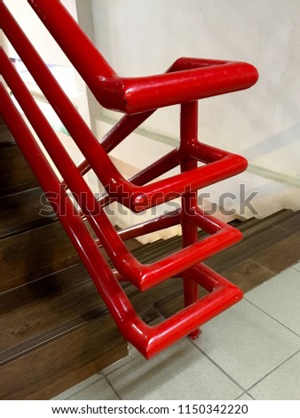 Steel handrail painted bright red color at stairway,steel railing